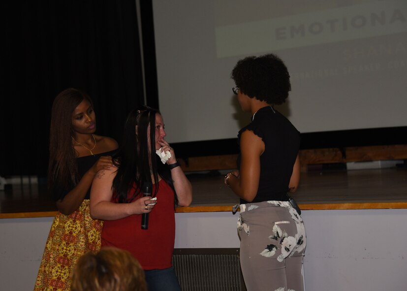 Tech. Sgt. Mindy Tyson, NCO in charge with the 319th Force Support Squadron, center, becomes emotional when Shana Robinson, international speaker, coach and business owner, right, talks to Tyson about problems that affect her in the work place. Robinson focused on emotional resilience during the conference, and stressed the importance of self-worth and self-motivation. (U.S. Air Force photo by Airman 1st Class Elora J. Martinez)