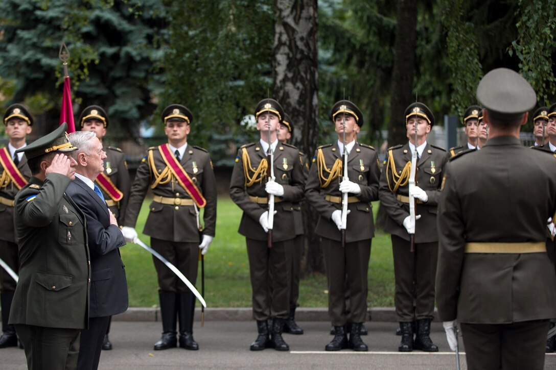 Defense Secretary Jim Mattis and the Ukrainian Defense Minister render honors.