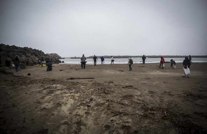 Marines, Sailors, Airmen banded together with Misawa City employees to participate in the beach cleanup.