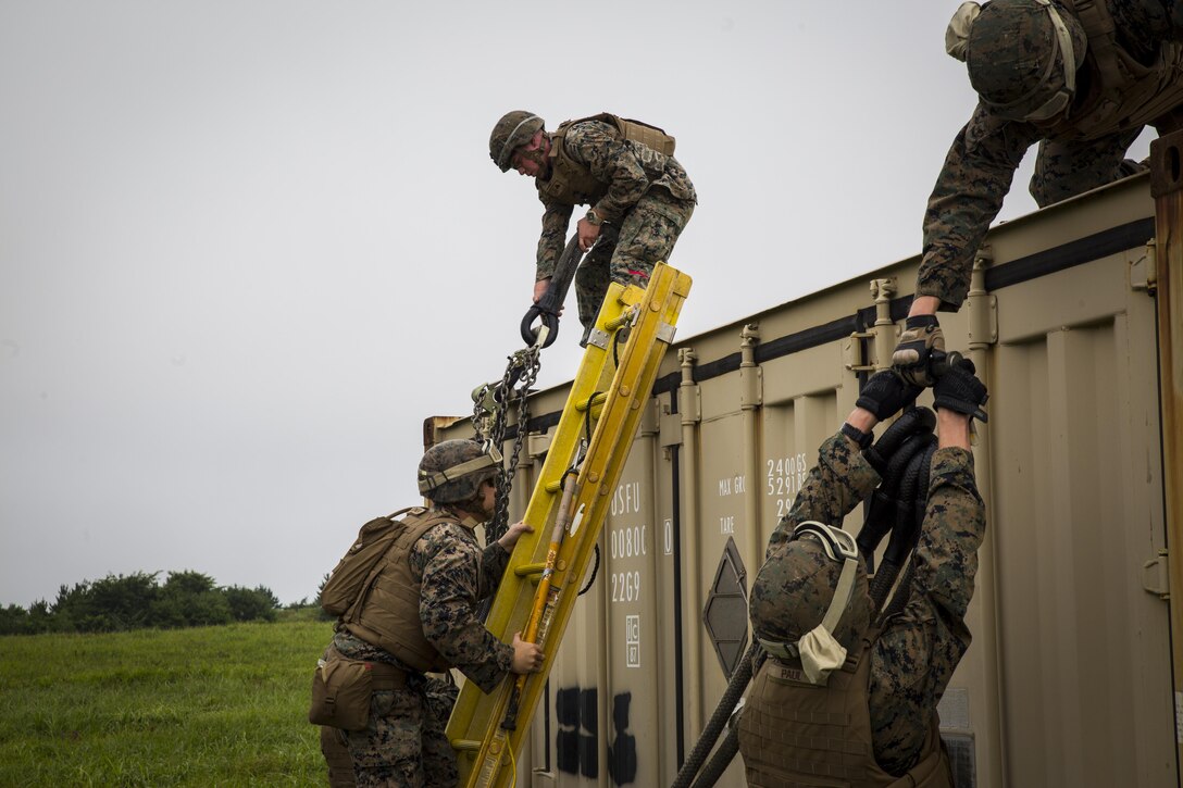 Landing support specialist Marines prepare the slings during external lift training at Draughon Range near Misawa Air Base, Japan, August 21, 2017, in support of exercise Northern Viper 17. This combined-joint exercise is held to enhance regional cooperation between participating nations to collectively deter security threats. The Marines are assigned to Combat Logistics Battalion 4, Combat Logistics Regiment 3, 3rd Marine Logistic Group. (U.S. Marine Corps photo by Lance Cpl. Andy Martinez)