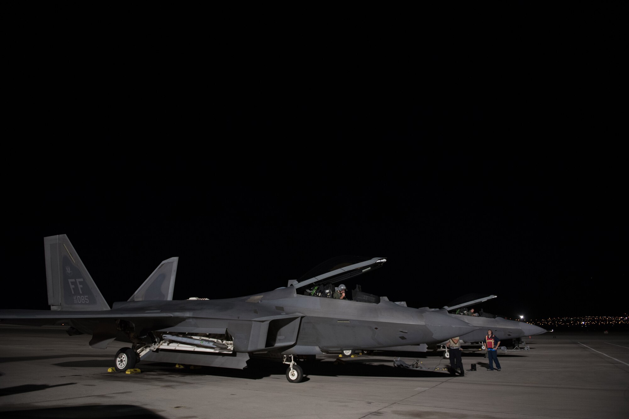 U.S. Air Force Capt. Flash, 94th Fighter Squadron pilot, prepares to start engines on a F-22 Raptor, during his mission commander upgrade certification at Red Flag 17-4 at Nellis Air Force Base, Nev., Aug. 21, 2017. Receiving this certification will now allow Flash to command a mission for joint service and coalition partners in the area of responsibility if called upon to do so.  (U.S. Air Force photo by Staff Sgt. Carlin Leslie)