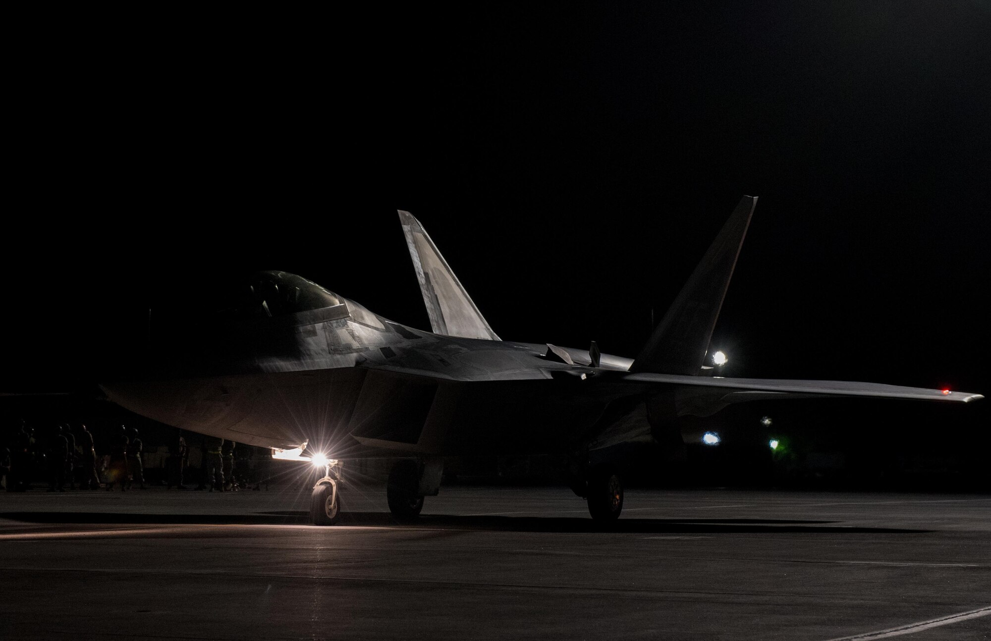 An U.S. Air Force F-22 Raptor taxis during Red Flag 17-4 at Nellis Air Force Base, Nev., Aug. 21, 2017.  Red Flag is a multi-dimensional air and ground war exercise, including jets, helicopters and ground forces in the simulated combat environment. (U.S. Air Force photo by Staff Sgt. Carlin Leslie)