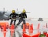 Firefighters with the Qatar Emiri Air Force Fire Department hose down cones during a joint C-130 Hercules aircraft exercise at Al Udeid Air Base, Qatar, Aug. 1, 2017. The cones represented a fuel fire that firefighters with the 379th Expeditionary Civil Engineer Squadron’s Fire and Emergency Services Flight and the Qatar Emiri Air Force Fire Department worked together to extinguish.  (U.S. Air Force photo by Tech. Sgt. Amy M. Lovgren)