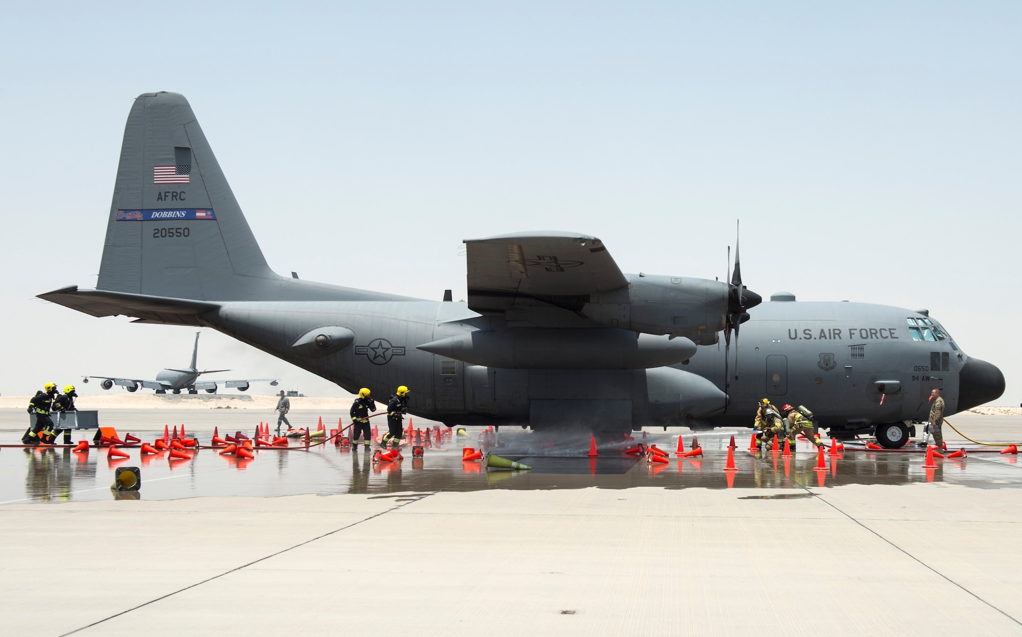 Firefighters with the 379th Expeditionary Civil Engineer Squadron’s Fire and Emergency Services Flight, and the Qatar Emiri Air Force Fire Department responsed to a simulated aircraft explosion during a joint C-130 Hercules aircraft exercise at Al Udeid Air Base, Qatar, Aug. 1, 2017.
