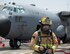 U.S. Air Force Staff Sgt. Matthew Slattery, lead firefighter with the 379th Expeditionary Civil Engineer Squadron’s Fire and Emergency Services Flight, completes a joint exercise at Al Udeid Air Base, Qatar, Aug. 1, 2017. Slattery and other firefighters participated in a joint C-130 Hercules aircraft exercise with the Qatar Emiri Air Force Fire Department and responded to a simulated aircraft explosion. (U.S. Air Force photo by Tech. Sgt. Amy M. Lovgren)