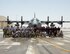 Firefighters with the 379th Expeditionary Civil Engineer Squadron’s Fire and Emergency Services Flight and the Qatar Emiri Air Force Fire Department pose for a group photo after a joint exercise at Al Udeid Air Base, Qatar, Aug. 1, 2017. The firefighters responded to a simulated aircraft explosion exercise where they worked together to extinguish the fire and save lives. (U.S. Air Force photo by Tech. Sgt. Amy M. Lovgren)