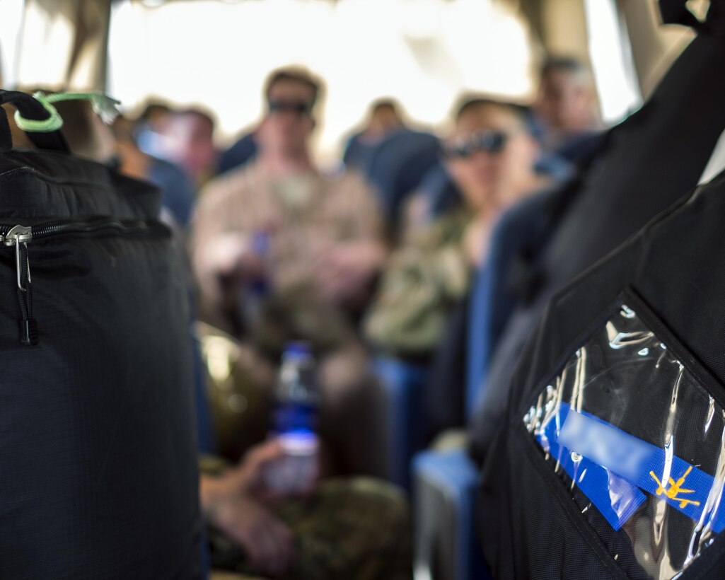 Flight crews and their bags ride to the flightline Aug. 23, 2017, at Al Dhafra Air Base, United Arab Emirates.