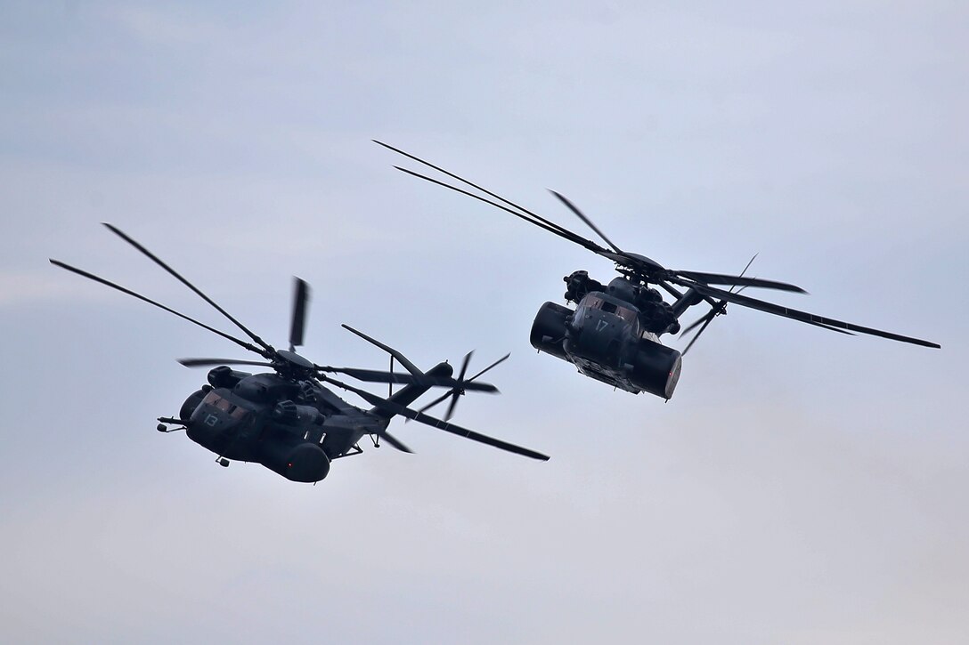 Two Navy MH-53 Sea Dragon helicopters fly during the Thunder Over the Boardwalk Air Show.