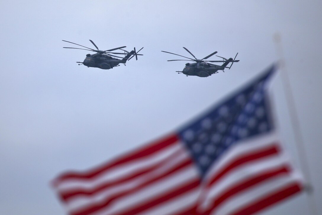 Navy MH-53 Sea Dragon helicopters fly during the Thunder Over the Boardwalk Air Show.