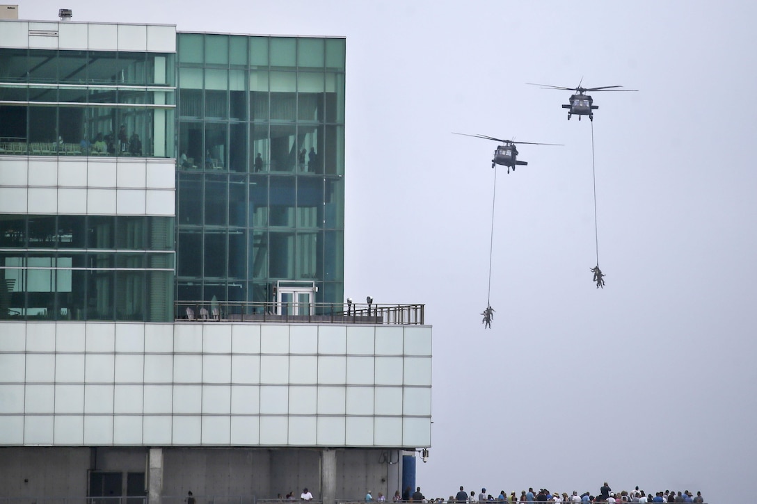 Army UH-60 Black Hawk helicopters demonstrate a Special Patrol Insertion & Exfiltration System.