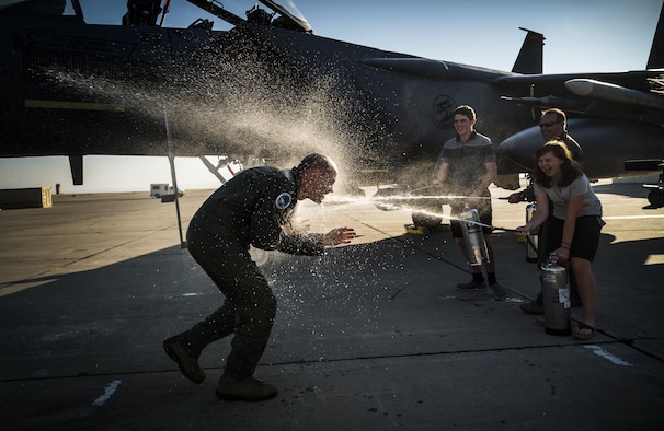 Col. Jefferson O'Donnell, 366th Fighter Wing commander, gets doused with water from his children and Vice Wing Commander Col. David Brynteson following his final flight at Mountain Home Air Force Base, Idaho, Aug. 16, 2017. O'Donnell will relinquish command of the 366th FW to Col. Joseph Kunkel during a change of command ceremony Sept. 8. O'Donnell's next assignment will be serving as Director, Air Force Colonels Management Office, at the Pentagon. (U.S. Air Force photo/Senior Airman Samuel Morse)