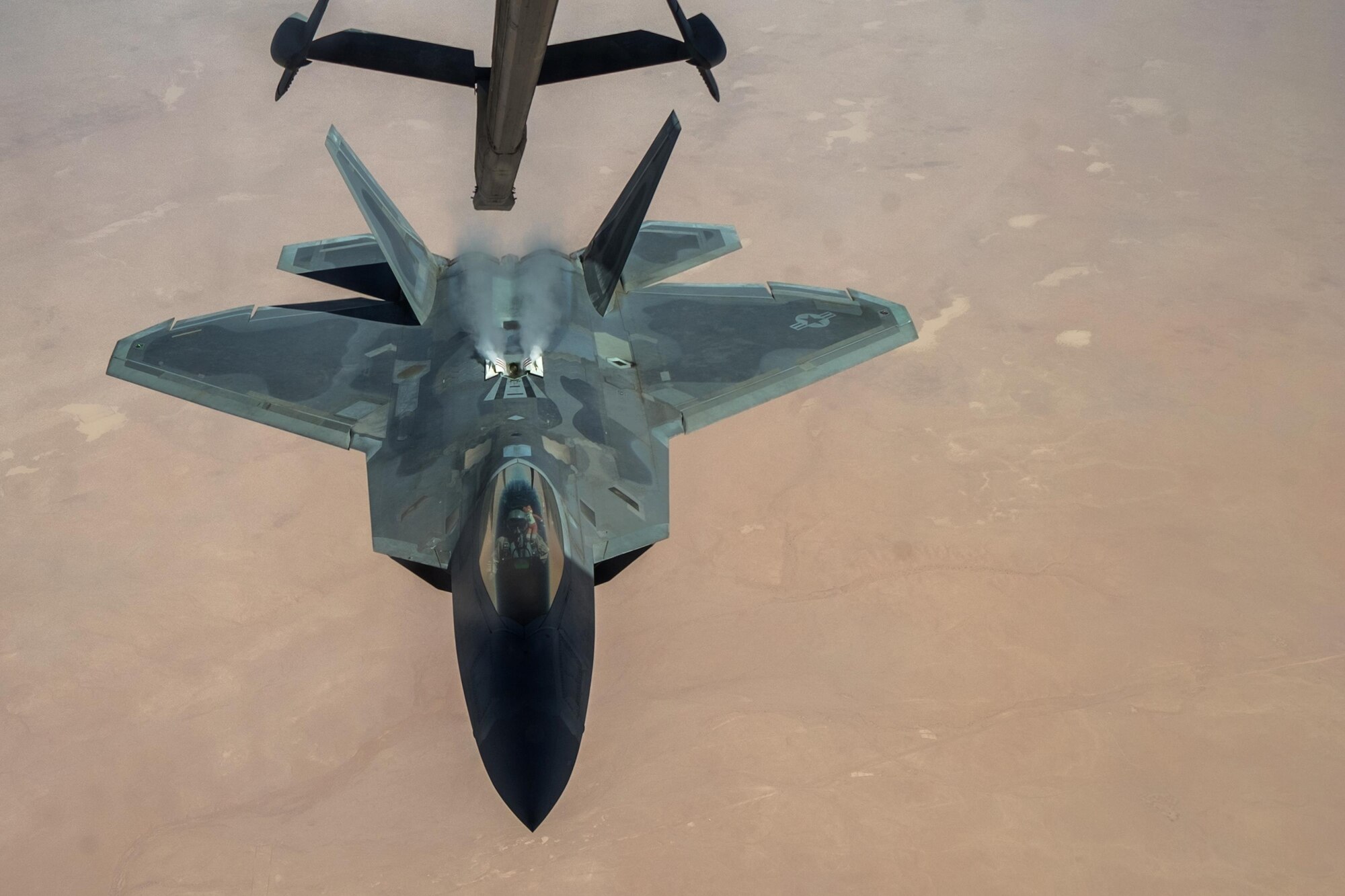 A 27th Expeditionary Fighter Squadron pilot disengages an F-22 Raptor from the boom of a 908th Expeditionary Air Refueling Squadron KC-10 Extender Aug. 22, 2017, in the skies over southwest Asia. As part of the Air Force Global Strike Task Force, members of the 27 EFS take the fight directly to ISIS. (U.S. Air Force photo by Senior Airman Preston Webb)