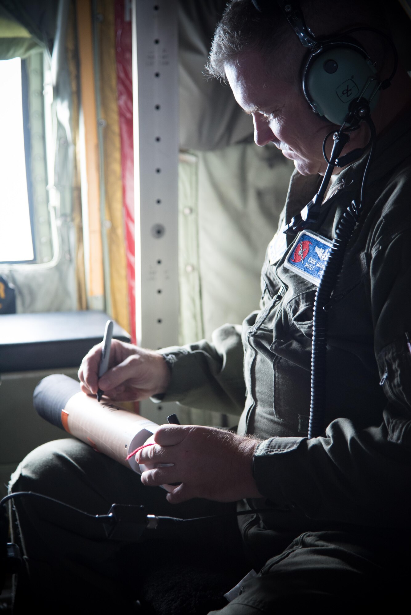 Master Sgt. Erik Marcus, 53rd Weather Reconnaissance Squadron loadmaster, prepares a dropsonde during a flight into Hurricane Harvey Aug. 24, 2017 out of Keesler Air Force Base, Mississippi. (U.S. Air Force photo/Staff Sgt. Heather Heiney)