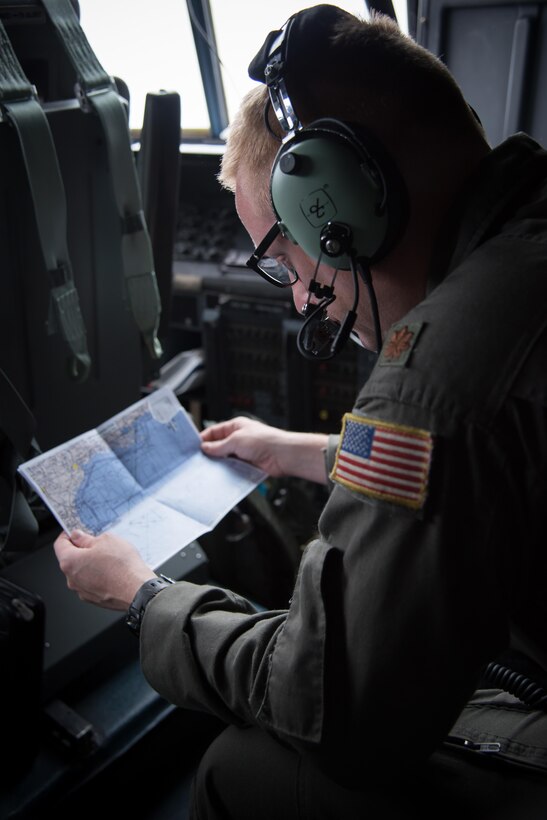 Maj. Grant Wagner, 53rd Weather Reconnaissance Squadron navigator, reviews a map of the Gulf of Mexico during a flight into Hurricane Harvey Aug. 24, 2017 out of Keesler Air Force Base, Mississippi. (U.S. Air Force photo/Staff Sgt. Heather Heiney)