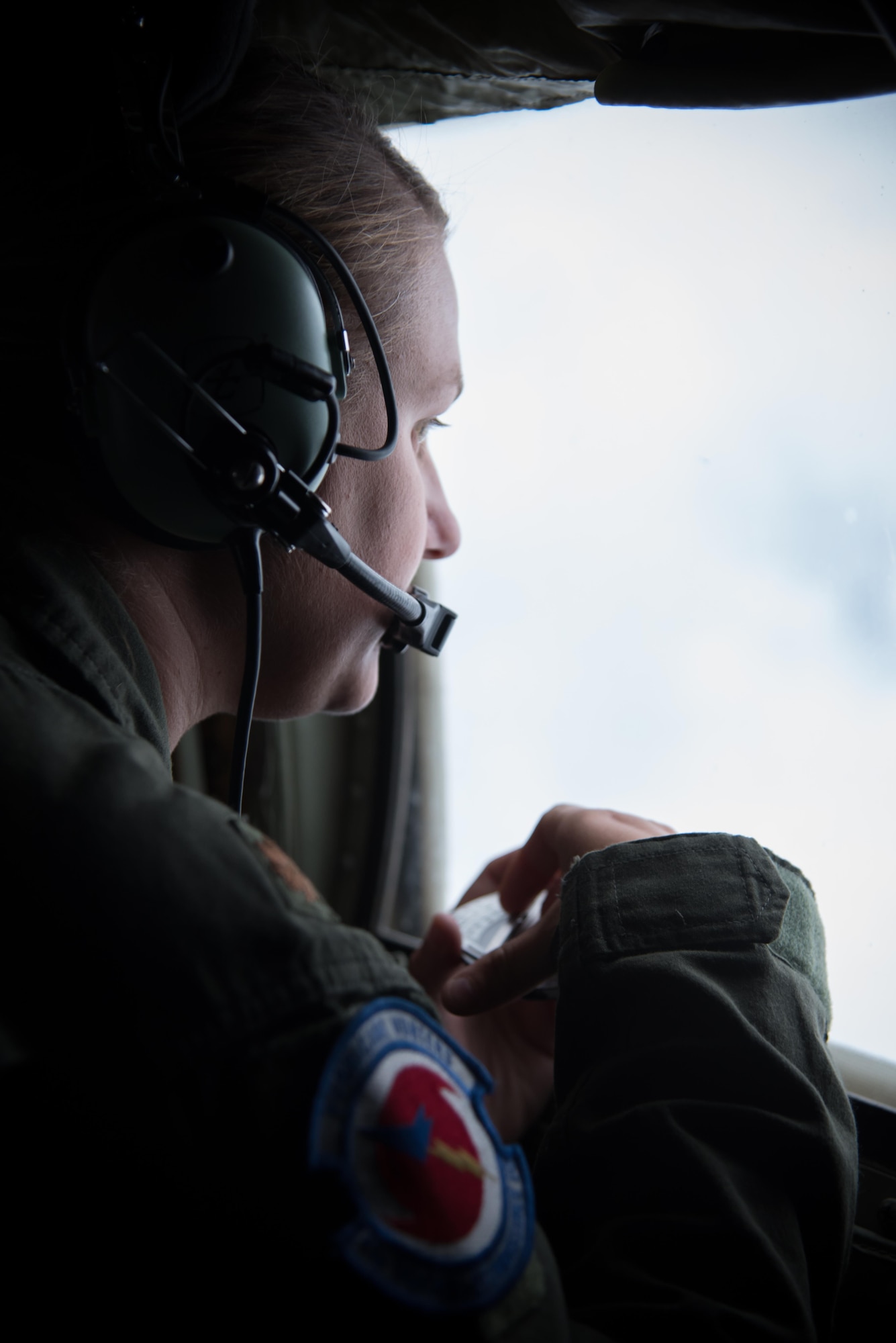 Maj. Kimberly Spusta, 53rd Weather Reconnaissance Squadron aerial reconnaissance weather officer, collects weather data for the National Hurricane Center during a flight into Hurricane Harvey Aug. 24, 2017 out of Keesler Air Force Base, Mississippi. (U.S. Air Force photo/Staff Sgt. Heather Heiney)