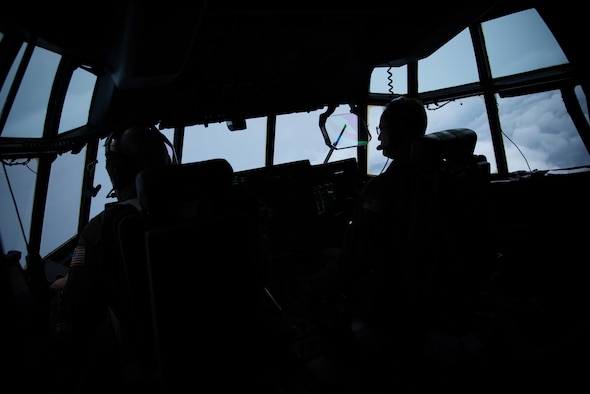 Maj. Kendall Dunn and Lt. Col. Ivan Deroche fly a WC-130J Super Hercules aircraft into Hurricane Harvey during a mission out of Keesler Air Force Base, Mississippi Aug. 24, 2017. (U.S. Air Force photo/Staff Sgt. Heather Heiney)