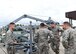 U.S. Air Force Airman 1st Class Michael Conard (left), 325th Maintenance Squadron aerospace ground equipment technician, describes trouble shooting procedures for a crane to Col. Michael Hernandez (2nd from right), 325th Fighter Wing commander, while on the flightline at Tyndall Air Force Base, Fla., Aug. 4, 2017. Conard was selected by his leadership to be shadowed by the wing commander due to his work ethic and for exemplifying the Air Force core values, thanks to the commander’s Airman Shadow Program.