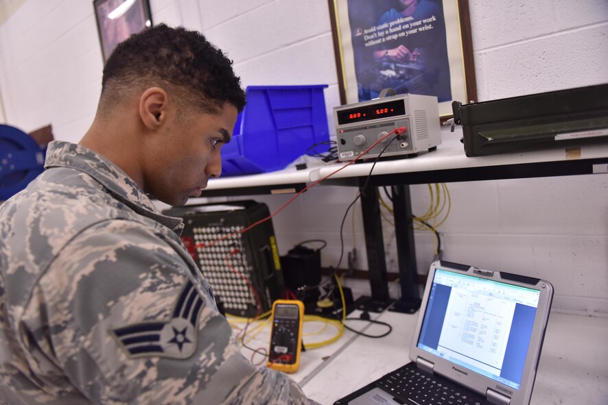 U.S. Air Force Senior Airman Christian Anthony, an electrical and environmental specialist assigned to the 509th Maintenance Squadron, reads the next step of a technical order (TO) before moving forward at Whiteman Air Force Base, Mo., Aug. 3, 2017.
