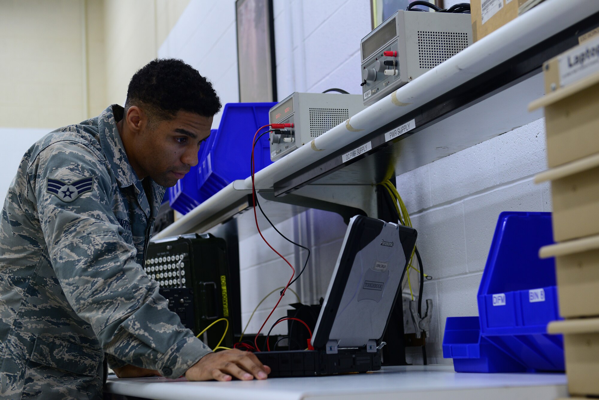 U.S. Air Force Senior Airman Christian Anthony, an electrical and environmental specialist assigned to the 509th Maintenance Squadron, reads the next step of a technical order (TO) before moving forward at Whiteman Air Force Base, Mo., Aug. 3, 2017.
