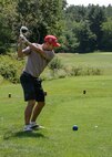 Golfer hits a shot at the Patriot Golf Course