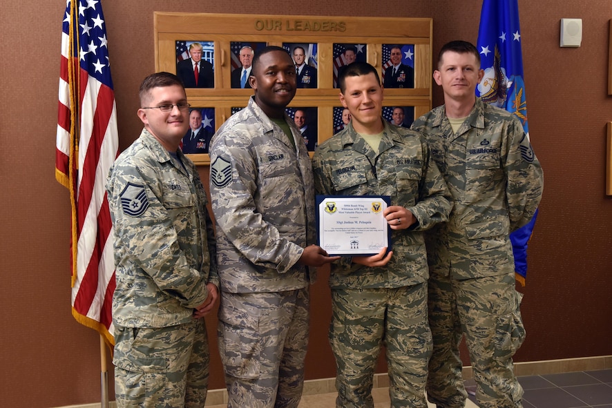U.S. Air Force Staff Sgt. Joshua Peloquin, a network administrator supervisor assigned to the 509th Communications Squadron, is presented with the Top III MVP Award at Whiteman Air Force Base (AFB), Mo., Aug. 18, 2017.