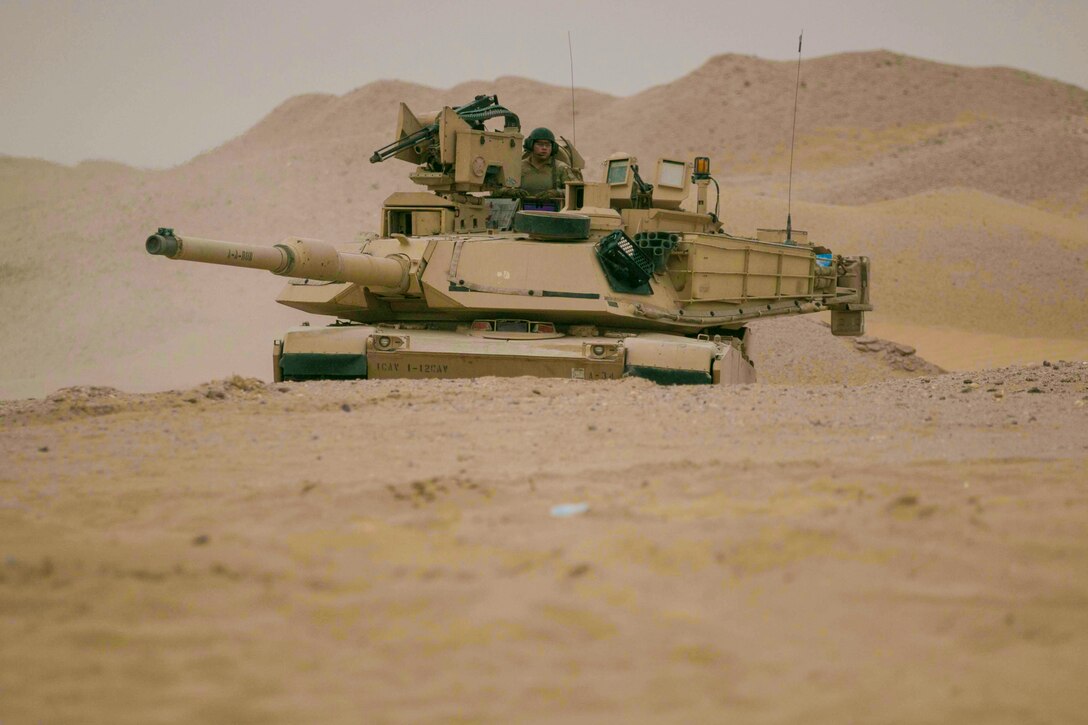 An M1A2 Abrams Main Battle Tank assigned to Alpha Company, 1st Battalion, 12th Cavalry Regiment, 3rd Armored Brigade Combat Team, 1st Cavalry Division maneuvers to the final objective during the company's situational training exercise July 15, 2017. The STX was used to validate the unit through mission essential tasks to sustain the readiness of the combined arms battalions.  (U.S. Army photo by Staff Sgt. Leah R. Kilpatrick)