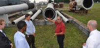 Image: DAHLGREN, Va. (Aug. 21, 2017) - Jim Green, a Potomac River Test Range safety expert, recounts the history of the Navy's 16 inch gun barrel for Science, Mathematics & Research for Transformation (SMART) Scholars during their tour of the Naval Surface Warfare Center Dahlgren Division (NSWCDD) main range. Green explained the inspection process for the 16 inch barrel in the 1940s, comparing it to today's inspections for the 5 inch and 76mm rifled barrel. "The Navy conducts a rigorous inspection process, then live fire testing to ensure the Fleet gun barrels are safe to be fired from a ship," he told the SMART scholars. The Missile Defense Agency sponsored the college students who are among those pursuing a degree in, or closely related to, science, technology, engineering, and mathematics disciplines through the Department of Defense SMART Scholar program. Students selected for SMART Scholarships are offered internships and a stepping stone to future civilian job opportunities in the federal government.