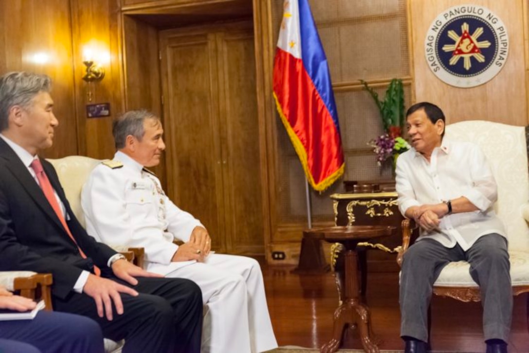 U.S. Ambassador to the Philippines Sung Y. Kim;  Navy Adm. Harry B. Harris Jr., commander of U.S. Pacific Command; and Philippine President Rodrigo R. Duterte meet in Malacañan Palace in Manila.