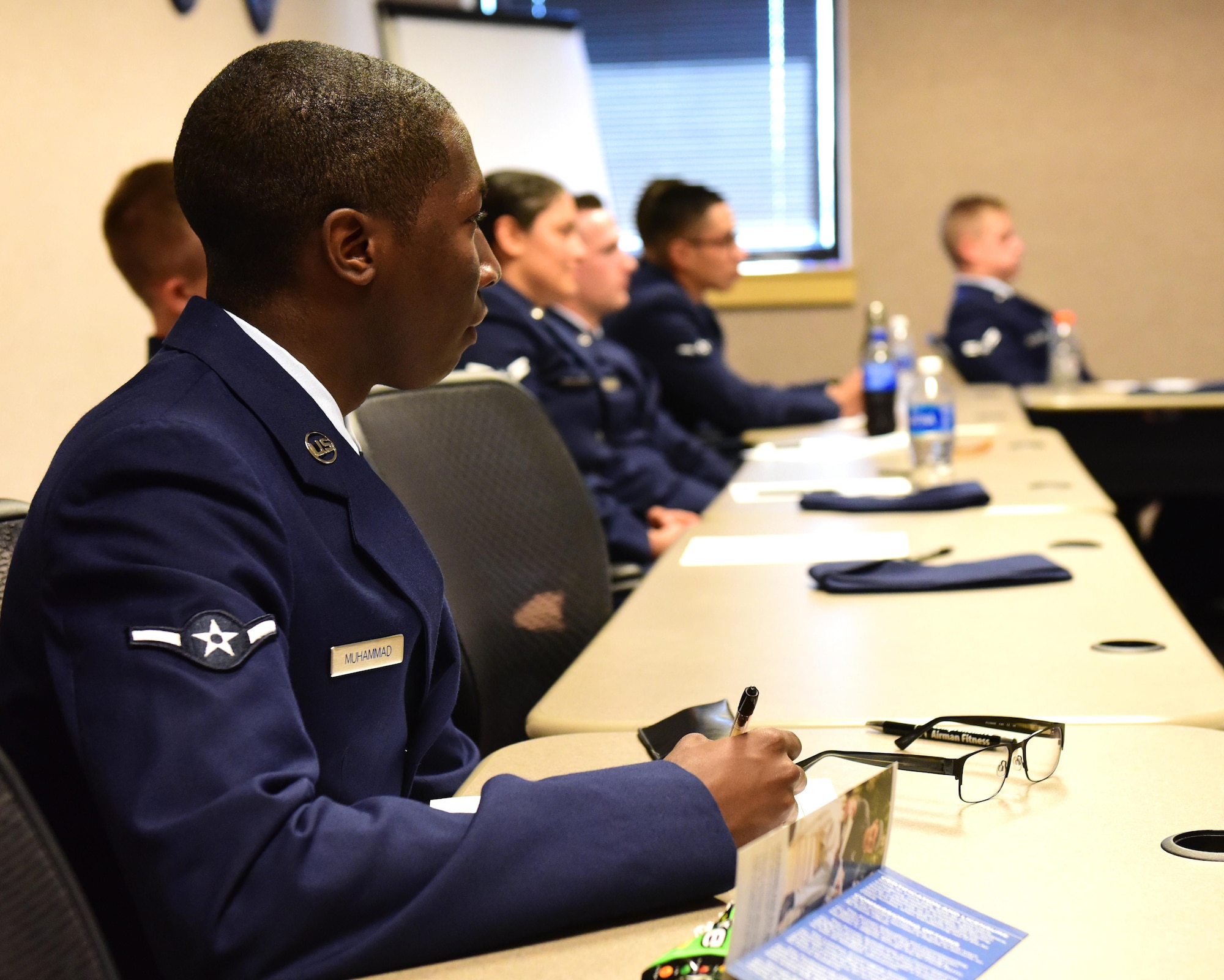 U.S. Air Force Airman Faheem Muhammad, a member of the 509 Aircraft Maintenance Squadron attending the First Term Airmen Course, listens to a discuss about  professionalism at Whiteman Air Force Base, Mo., July 24, 2017. The new FTAC is a five-day class that consists of briefs from different base agencies, 13 hours of professionalism training and tours of a B-2 Spirit and the Oscar-1 Minuteman Missile Alert Facility. (U.S. Air Force photo/Staff Sgt. Danielle Quilla)