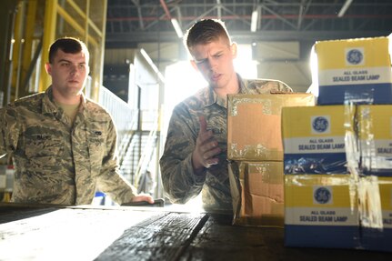 Airman 1st Class Vance Boswell, 628th Logistics Readiness Squadron vehicle operator, unloads cargo at Joint Base Charleston, S.C., Aug. 23, 2017.