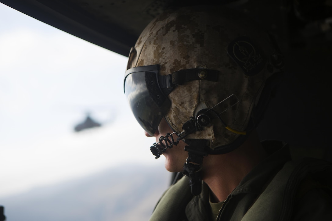 MARINE CORPS AIR STATION CAMP PENDLETON, Calif. – Cpl. Noah Schultz, a Marine Light Attack Helicopter (HMLA) 469 UH-1W crew chief, scans the horizon for threats during a simulated tactical recovery of aircraft and personnel (TRAP) mission on Marine Corps base Camp Pendleton, Aug. 23. Simulated TRAP exercises give HMLA-469 pilots muscle memory experience to operate mission essential tasks seamlessly during forward deployed operations.