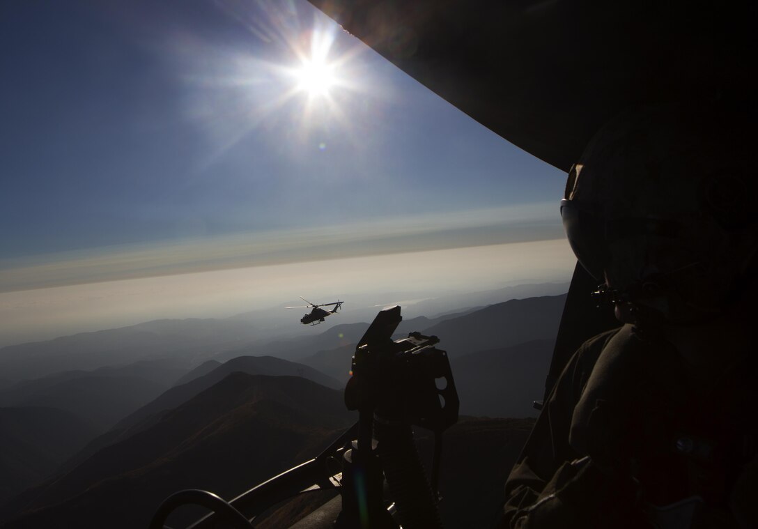 MARINE CORPS AIR STATION CAMP PENDLETON, Calif. – A Marine Light Attack Helicopter (HMLA) 469 UH-1Y provides close air support during a simulated tactical recovery of aircraft and personnel (TRAP) mission on Marine Corps base Camp Pendleton, Aug. 23. Simulated TRAP exercises give HMLA-469 pilots muscle memory experience to operate mission essential tasks seamlessly during forward deployed operations.