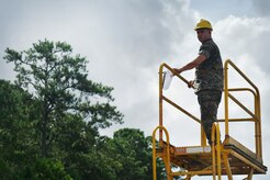 U.S. Marine Cpl. Melvin Willis, Navy Munitions Command Atlantic Unit Charleston Marine Corps Liaison Office member, waits for the arrival of a train transporting munitions during a container download operation at the Joint Base Charleston Weapons Station, S.C., Aug. 21. Marines attached to the NMC’s Marine Corps Liaison Office are responsible for inspecting munitions containers to ensure they are receiving safe quality items during the download. These Marines work alongside NMC civilians and members of the U.S. Air Force 628th Logistics Readiness Squadron to prepare them for transport to their final destination.