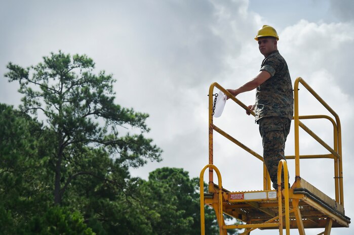 U.S. Marine Cpl. Melvin Willis, Naval Munitions Command Marine Corps Liaison Office member, waits for the arrival of a train transporting munitions during a container download operation at the Joint Base Charleston Weapons Station, S.C., Aug. 21. Marines attached to the NMC’s Marine Corps Liaison Office are responsible for inspecting munitions containers to ensure they are receiving safe quality items during the download. These Marines work alongside NMC civilians and members of the U.S. Air Force 628th Logistics Readiness Squadron to prepare them for transport to their final destination.