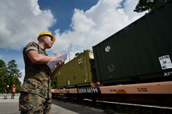 U.S. Marine Cpl. Melvin Willis, Navy Munitions Command Atlantic Unit Charleston Marine Corps Liaison Office member, inspects containers carrying munitions during an inspection at the Joint Base Charleston Weapons Station, S.C., Aug. 21. Marines attached to the NMC’s Marine Corps Liaison Office are responsible for inspecting munitions containers to ensure they are receiving safe quality items during the download. These Marines work alongside NMC civilians and members of the U.S. Air Force 628th Logistics Readiness Squadron to prepare them for transport to their final destination.