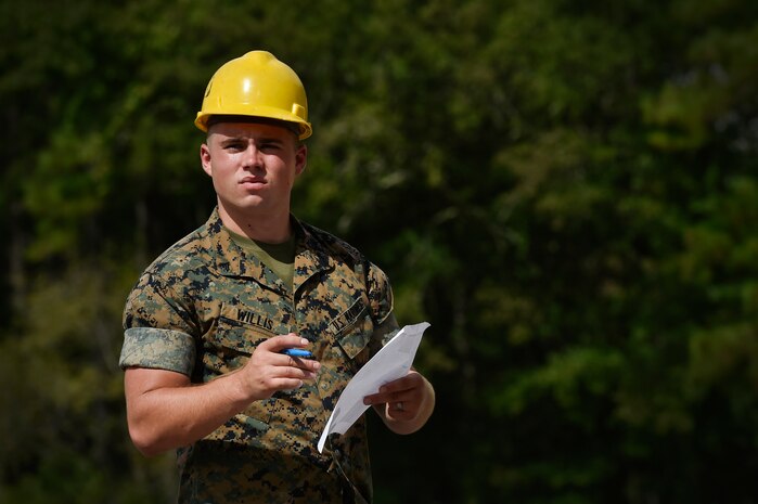 U.S. Marine Cpl. Melvin Willis, Naval Munitions Command Marine Corps Liaison Office member, inspects munitions containers at the Joint Base Charleston Weapons Station, S.C., Aug. 21. Marines attached to the NMC’s Marine Corps Liaison Office are responsible for inspecting munitions containers to ensure they are receiving safe quality items during the download. These Marines work alongside NMC civilians and members of the U.S. Air Force 628th Logistics Readiness Squadron to prepare them for transport to their final destination.