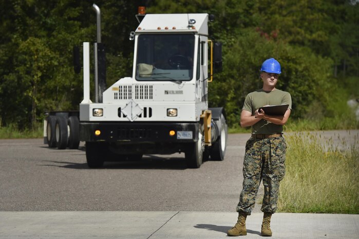 U.S. Marine Sgt. Andrew Dunn, Naval Munitions Command Marine Corps Liaison Office member, records munitions container information during an inspection at the Joint Base Charleston Weapons Station, S.C., Aug. 21. Marines attached to the NMC’s Marine Corps Liaison Office are responsible for inspecting munitions containers to ensure they are receiving safe quality items during the download. These Marines work alongside NMC civilians and members of the U.S. Air Force 628th Logistics Readiness Squadron to prepare them for transport to their final destination.