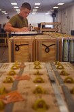 U.S. Marine Sgt. Andrew Dunn, Navy Munitions Command Atlantic Unit Charleston Marine Corps Liaison Office member, records inventory information during a munitions inspection at the Joint Base Charleston Weapons Station, S.C., Aug. 23. Marines attached to the NMC’s Marine Corps Liaison Office are responsible for inspecting munitions containers to ensure they are receiving safe quality items during the download. These Marines work alongside NMC civilians and members of the U.S. Air Force 628th Logistics Readiness Squadron to prepare them for transport to their final destination.