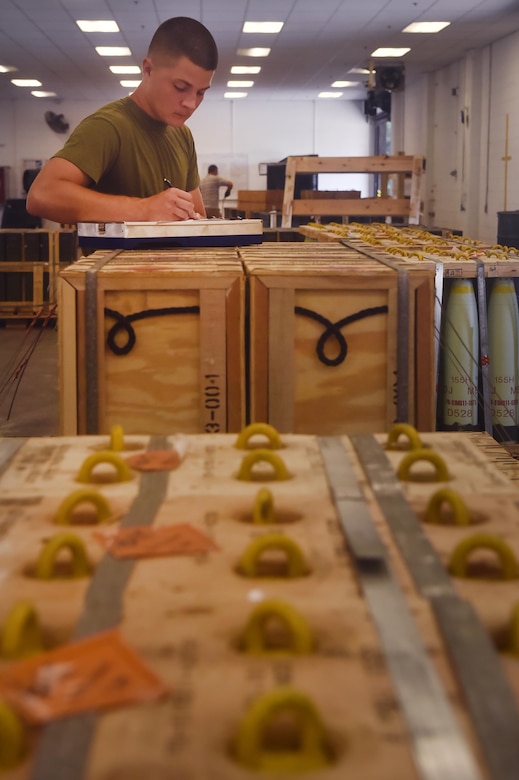 U.S. Marine Sgt. Andrew Dunn, Naval Munitions Command Marine Corps Liaison Office member, records inventory information during a munitions inspection at the Joint Base Charleston Weapons Station, S.C., Aug. 23. Marines attached to the NMC’s Marine Corps Liaison Office are responsible for inspecting munitions containers to ensure they are receiving safe quality items during the download. These Marines work alongside NMC civilians and members of the U.S. Air Force 628th Logistics Readiness Squadron to prepare them for transport to their final destination.