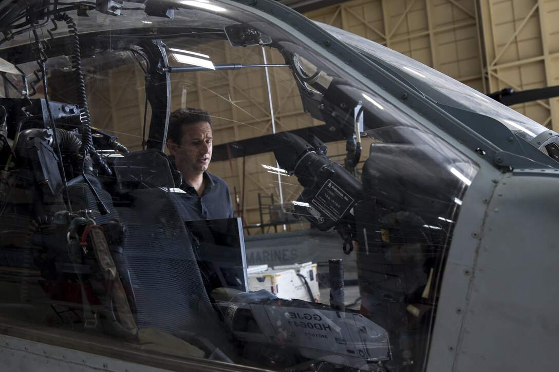 U.S. Sen. Brian Schatz, Hawaii, looks inside the cockpit of a U.S. Marine Corps UH-1Y Huey helicopter assigned to Marine Light Attack Helicopter Squadron 367, aboard Marine Corps Base Hawaii (MCBH), Aug. 24, 2017. Schatz travelled to MCBH to discuss and learn more about concerns regarding capabilities, readiness, and future challenges to Marines in the region and discussed the projection of power, production of readiness, and promotion of resiliency with current and future military projects. (U.S. Marine Corps photo by Sgt. Alex Kouns/Released)