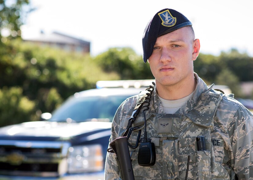Airman 1st Class Colby Morin, a 66th Security Forces Squadron member, poses for a photo in October 2016 after he was selected as the 66th Air Base Group's Patriot of the Week. During a recent deployment overseas, Morin volunteered to attend the U.S. Marine Corps' Lance Corporal Seminar for E-3s. (U.S. Air Force photo/Mark Herlihy)