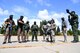 Airmen with the 319th Security Forces Squadron, U.S. Customs and Border Protection agents, and officers with the Grand Forks Sheriff’s Department gather to discuss a plan of entry during a training exercise at Carl Ben Eielson Elementary School Aug. 9, 2017, on Grand Forks Air Force Base, N.D. The USCBP led the three-day event, providing classroom and hands-on training dealing with a variety of active-shooter scenarios.  (U.S. Air Force photo by Airman 1st Class Elora J. Martinez)