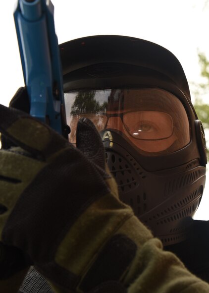Airman 1st Class Caitlyn Roden, entry controller with the 319th Security Forces Squadron, prepares to enter Carl Ben Eielson Elementary School as part of a training exercise Aug. 9, 2017, on Grand Forks Air Force Base, N.D. Groups of law enforcement officers, to include Airmen, took turns running through active-shooter scenarios set up by the U.S. Customs and Border Protection supervisory agents.  (U.S. Air Force photo by Airman 1st Class Elora J. Martinez)