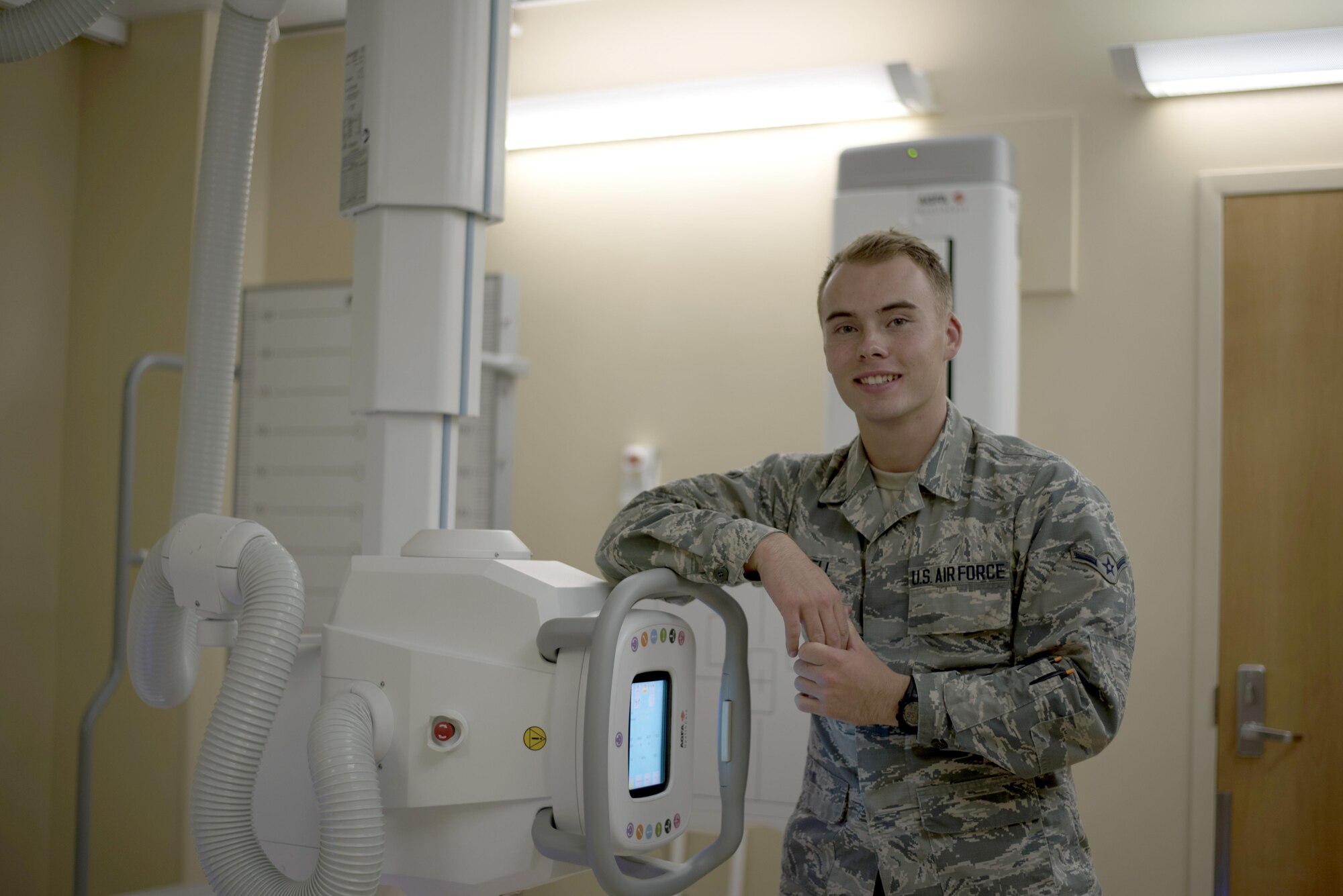 U.S Air Force Airman Byraun Howell, a radiology student assigned to the 6th Medical Support Squadron, pauses for a photo with equipment used to perform his job duties at MacDill Air Force Base, Fla., Aug. 16, 2017.