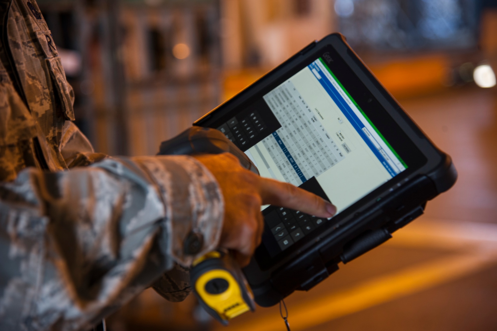 Staff Sgt. Philip Beasley, 735th Air Mobility Squadron assistant air freight shift supervisor, performs cargo inventory using a new digital program at Joint Base Pearl Harbor-Hickam, Hawaii, Aug. 24, 2017.
