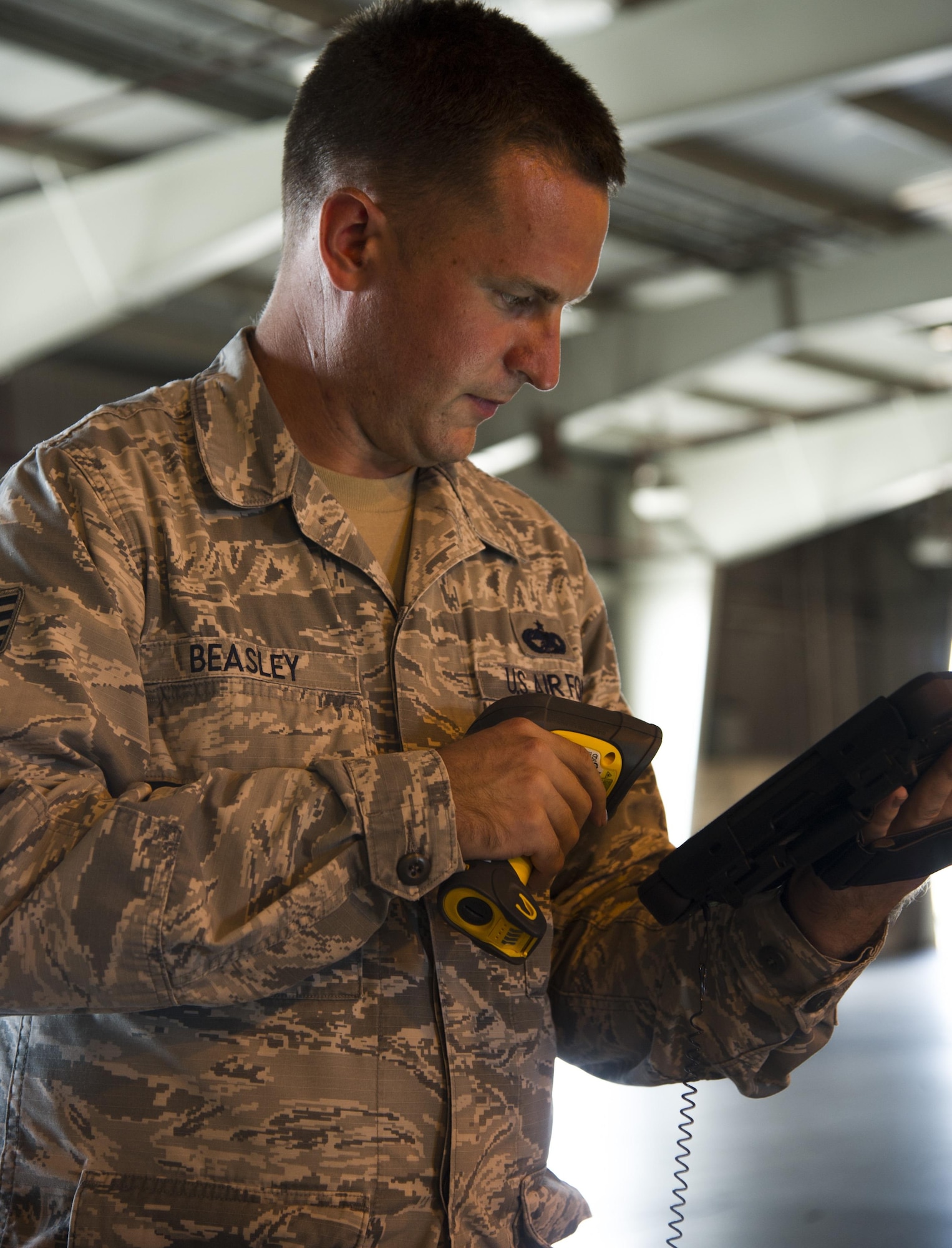 Staff Sgt. Philip Beasley, 735th Air Mobility Squadron assistant air freight shift supervisor, performs cargo inventory using a new digital program at Joint Base Pearl Harbor-Hickam, Hawaii, Aug. 24, 2017.
