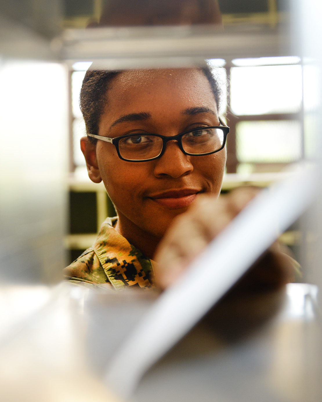 Sgt. Hope Timberlake, postal clerk, Post Office, Marine Corps Logistics Base Albany, distributes mail to appropriate personnel, Aug. 21. She as meritoriously promoted to her current rank during a ceremony held here, Aug. 2.