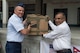 U.S. Air Force Lt. Col. Gary Dodge, Pacific Angel (PACANGEL) 17-4 mission commander, presents donated school supplies to Keshab Raj Sharma, the Assistant Chief District Officer, during PACANGEL in Gorkha, Nepal, Aug. 20, 2017. PACANGEL is a multi-lateral humanitarian assistance civil military engagement, which improves military-to-military partnerships in the Pacific while also providing medical health outreach, civic engineering projects and subject matter exchanges among partner forces. (U.S. Air Force photo by Airman 1st Class Valerie Monroy)