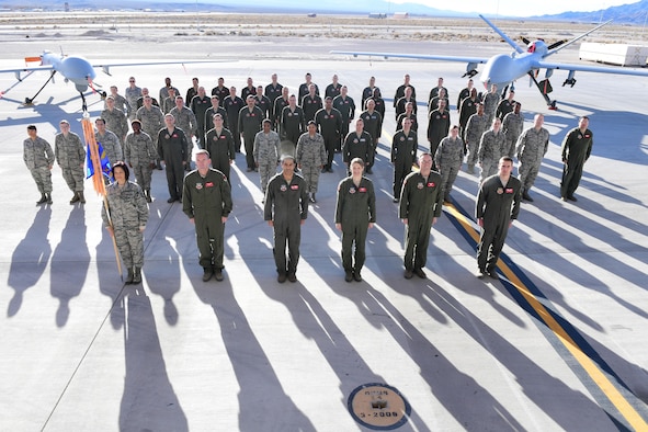 Members of the 867th Attack Squadron stand at attention for a group photo on Dec. 15, 2016, at Creech Air Force Base, Nev.