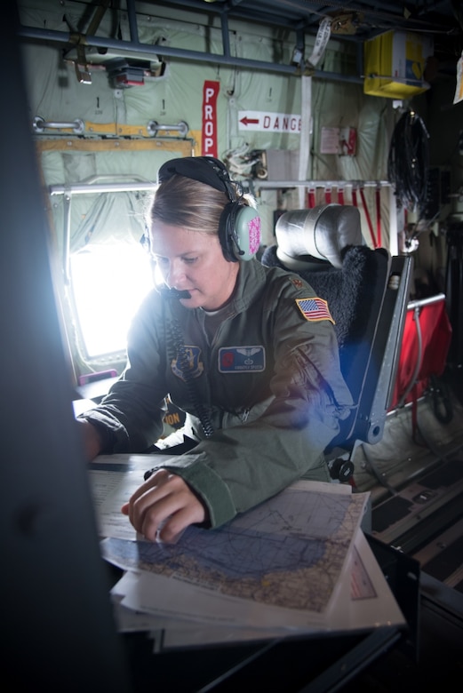 Air Force Maj. Kimberly Spusta, 53rd Weather Reconnaissance Squadron aerial reconnaissance weather officer, collects weather data.